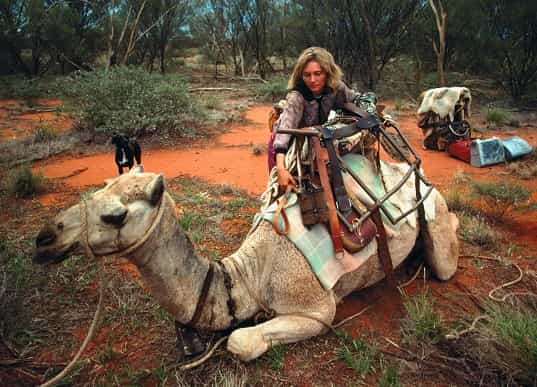 Robyn Davidson, Robyn Davidson Tracks, Australian desert journey, Robyn Davidson biography, Robyn Davidson book, Tracks by Robyn Davidson, Robyn Davidson movie, Robyn Davidson camels, Robyn Davidson dog Diggity, Robyn Davidson National Geographic, desert trek Australia, Robyn Davidson adventure, Robyn Davidson memoir, Robyn Davidson Unfinished Woman, Australian solo trek, women adventurers, Australian Outback journey, Robyn Davidson life story, Robyn Davidson challenges, Robyn Davidson preparation.