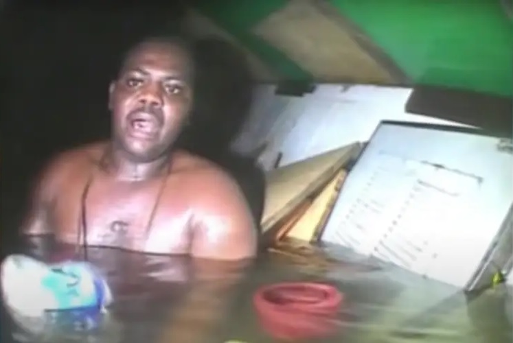 Harrison Okene seen in bodycam footage the moment he was rescued in 2013, in the air bubble of an upturned boat.